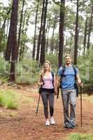 Young happy hiker couple hiking