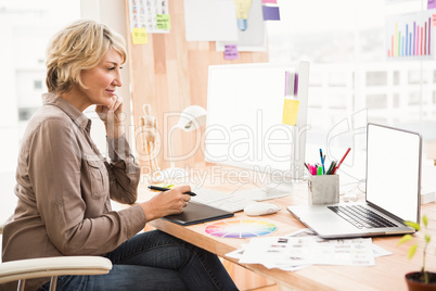 Casual designer working at her desk