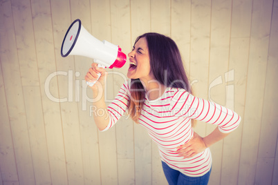 Pretty hipster shouting through megaphone