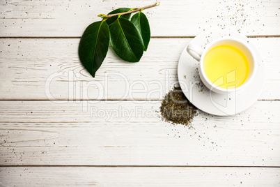 Cup of herbal tea on table