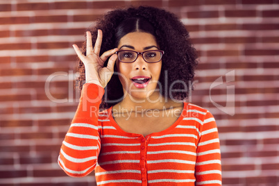 Attractive woman posing with hipster glasses