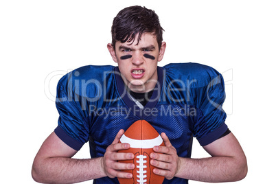 Enraged american football player holding a ball