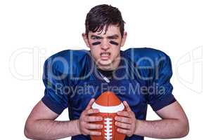 Enraged american football player holding a ball