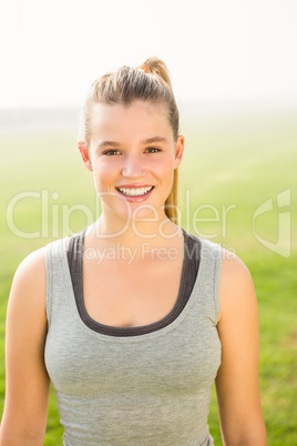 Smiling sporty blonde looking at camera