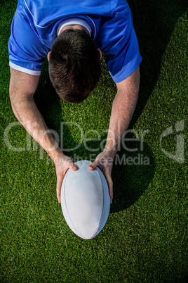 A rugby player scoring a try