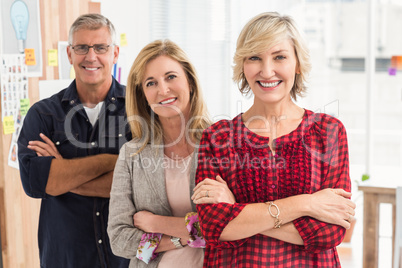 Smiling business team looking at the camera