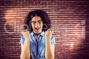 Attractive hipster celebrating success