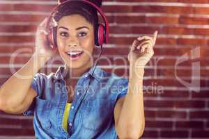 Portrait of young woman smiling at her song