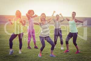 Happy sporty women dancing during fitness class