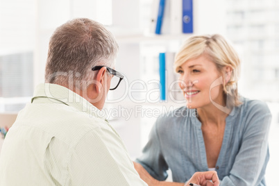 Smiling business team talking together