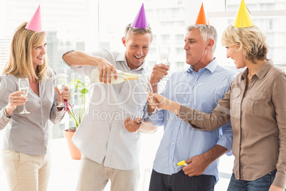 Casual business people making birthday toasts