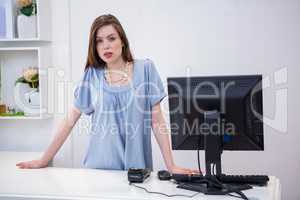 Shop worker standing by the till