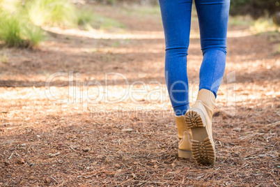 Close up view of woman hiking on path