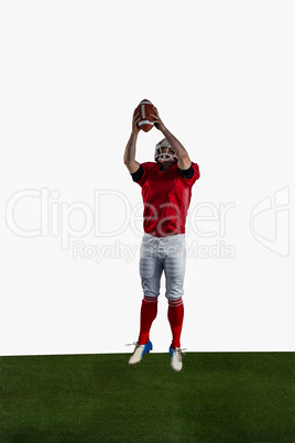 American football player catching football