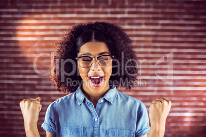 Attractive hipster celebrating success