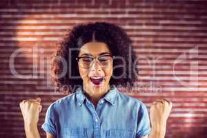 Attractive hipster celebrating success