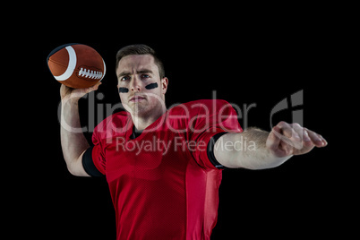 American football player about to throw the ball