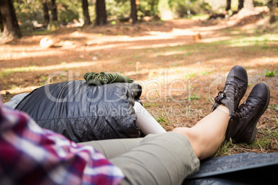 Female camper sitting in tent