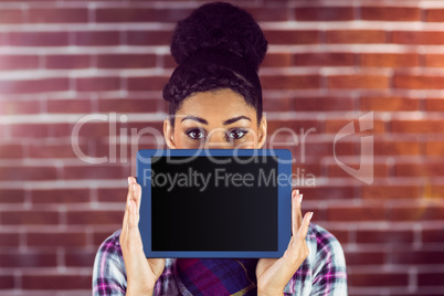 A female hipster holding a tablet