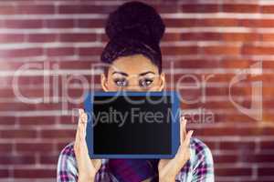 A female hipster holding a tablet