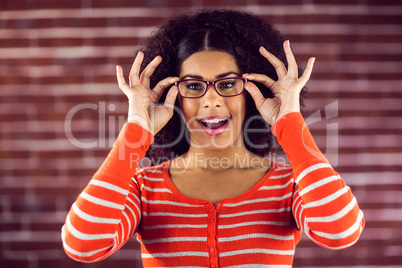 Smiling attractive woman posing with hipster glasses