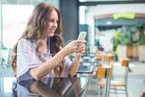 Pretty brunette sending a text