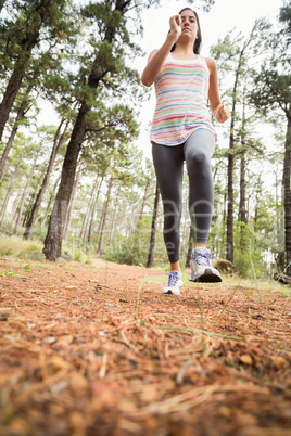 Young happy jogger walking