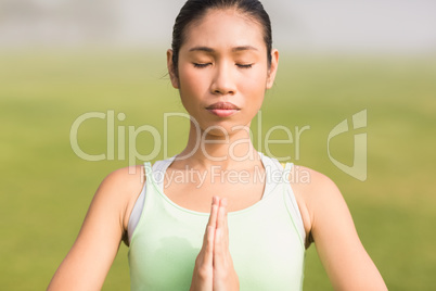 Peaceful sporty woman doing yoga