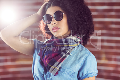 Attractive young woman wearing sunglasses