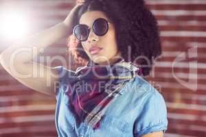 Attractive young woman wearing sunglasses
