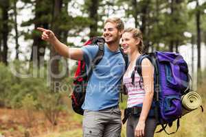 Young happy hikers looking in the distance