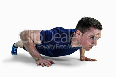 A fit man doing push ups