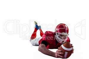 American football player reaching football