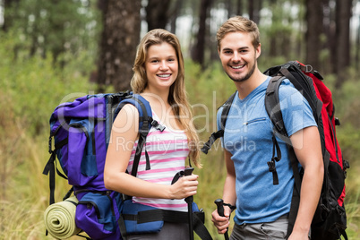 Portrait of a young happy hikers couple