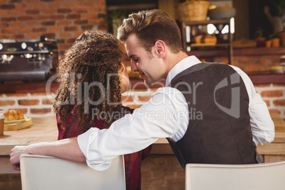 Young happy couple about to kiss