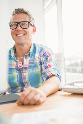 Smiling casual designer working with digitizer