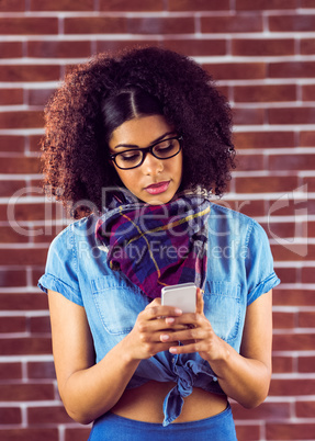 Attractive serious hipster texting