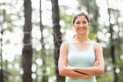 Young happy jogger looking at camera