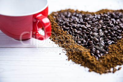 Coffee on a table in heart shape with cup