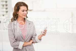 Casual businesswoman using smartphone