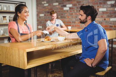 Young man taking his receipt