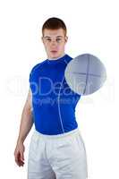 Rugby player handing a rugby ball