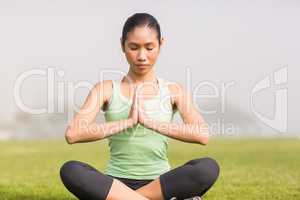 Peaceful sporty woman doing yoga