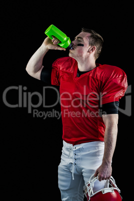 American football player drinking