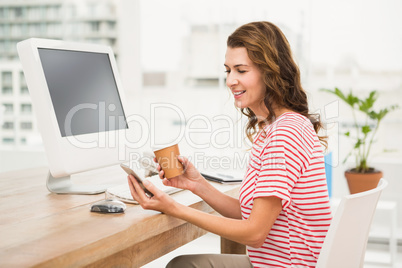 Casual businesswoman using smartphone