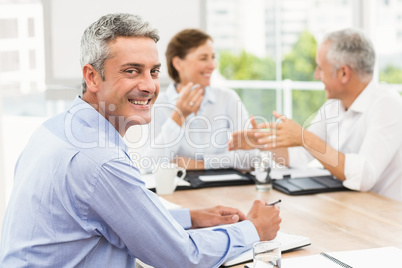 Smiling businessman in a meeting