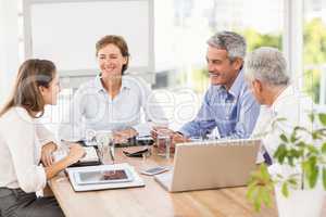 Smiling business people having a meeting