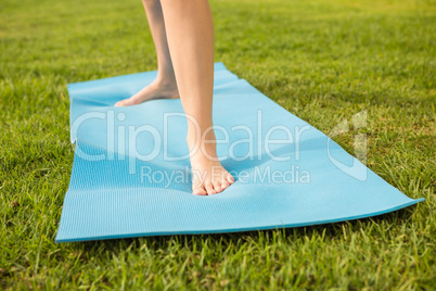 Feet standing on exercise mat