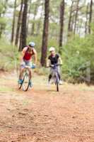 Pretty biker couple biking