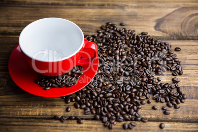 Coffee beans on a table with cup